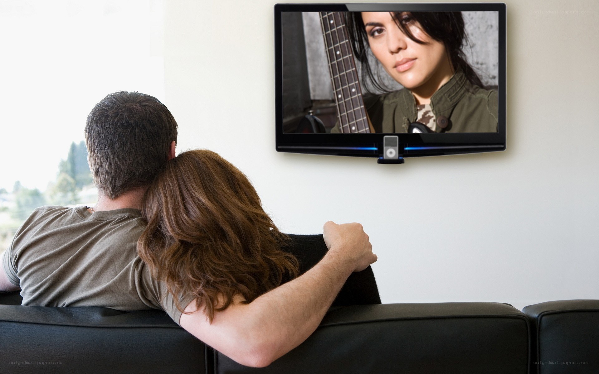 Couple watching TV on couch