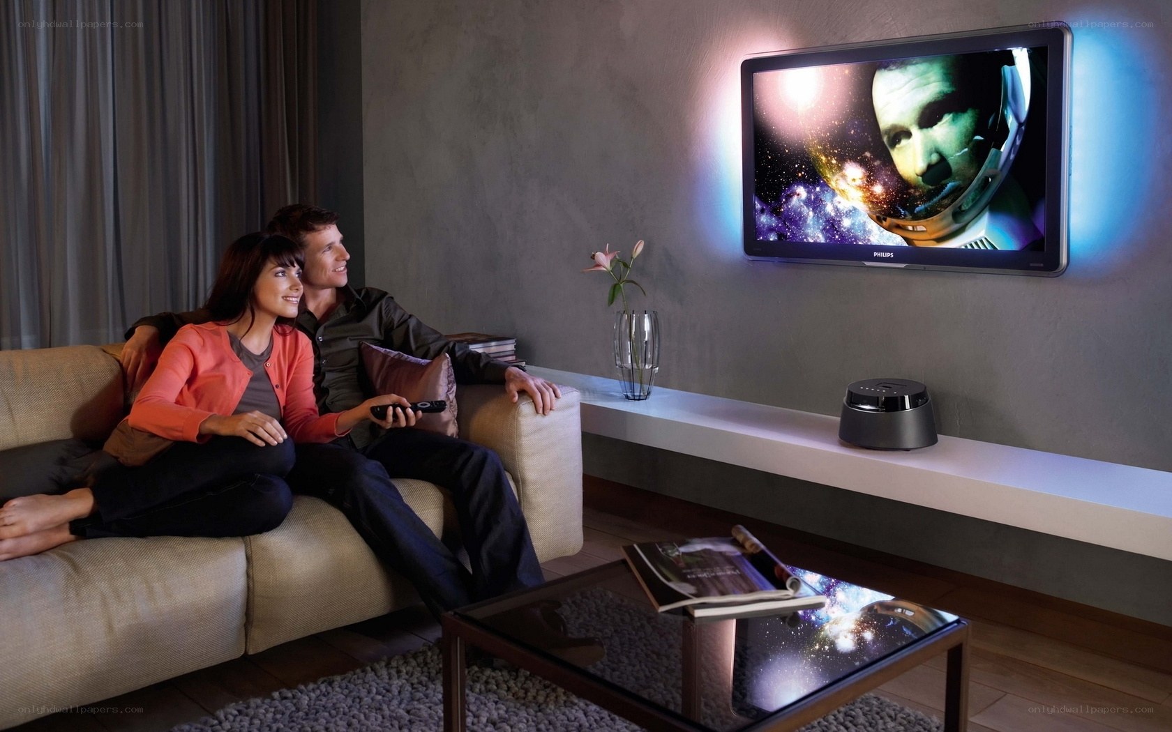 Couple watching TV on couch