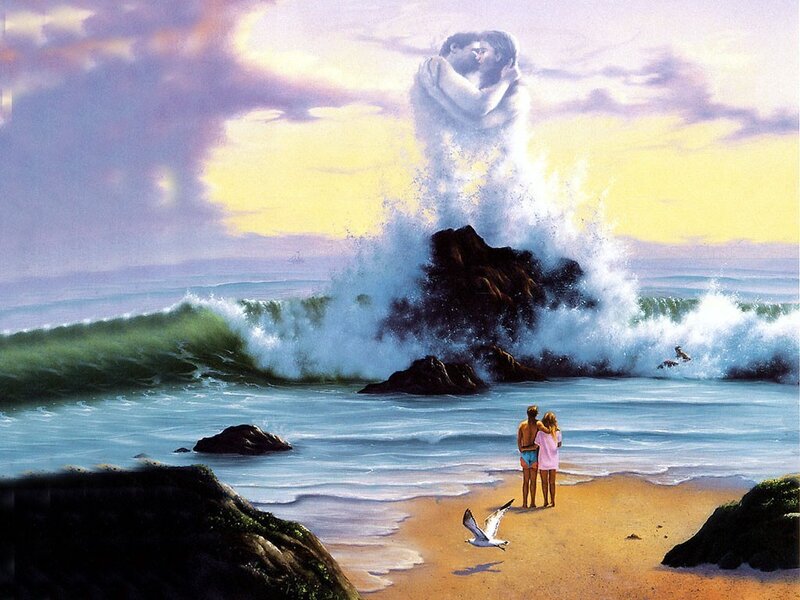 Couple watching waves at sunset