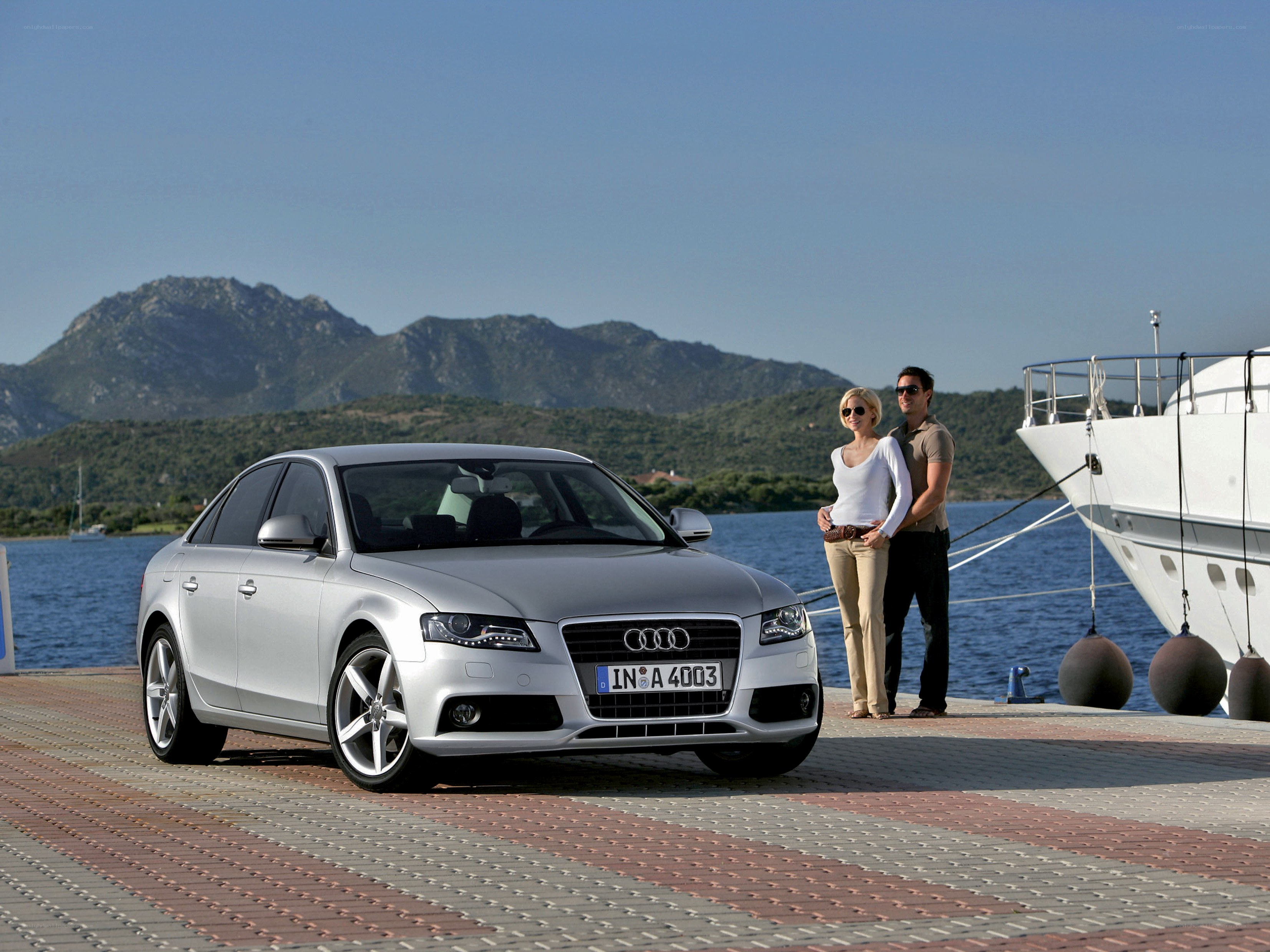 Couple with Audi at marina