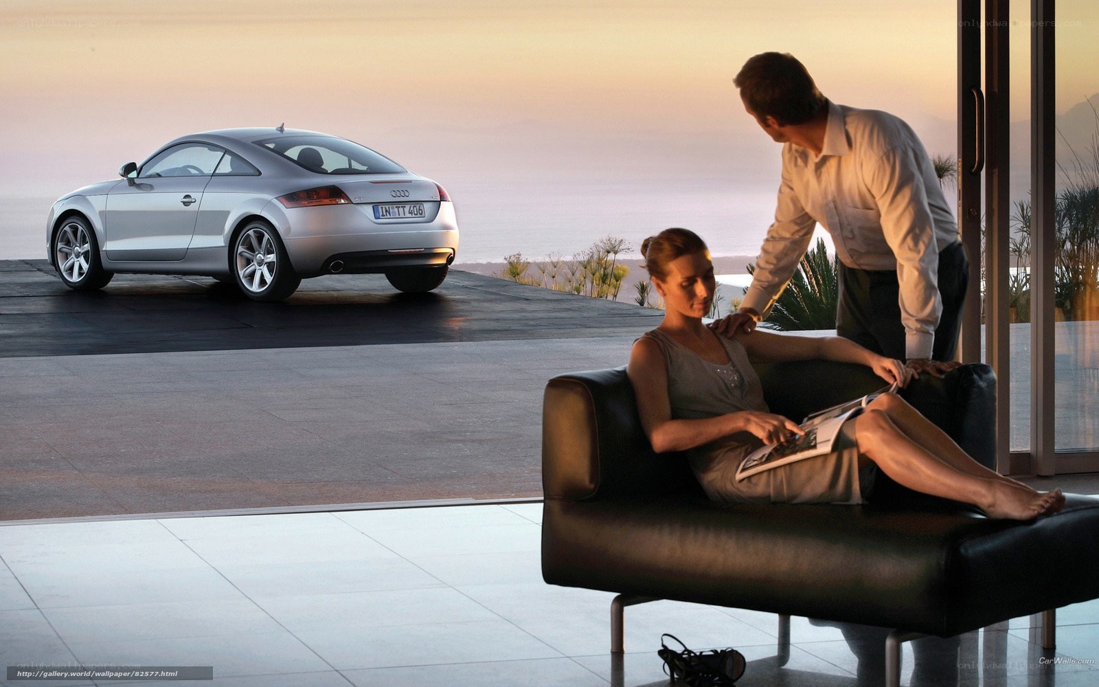 Couple with Audi TT at sunset