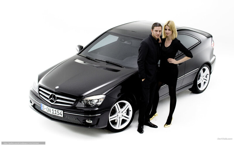 Couple with black Mercedes-Benz