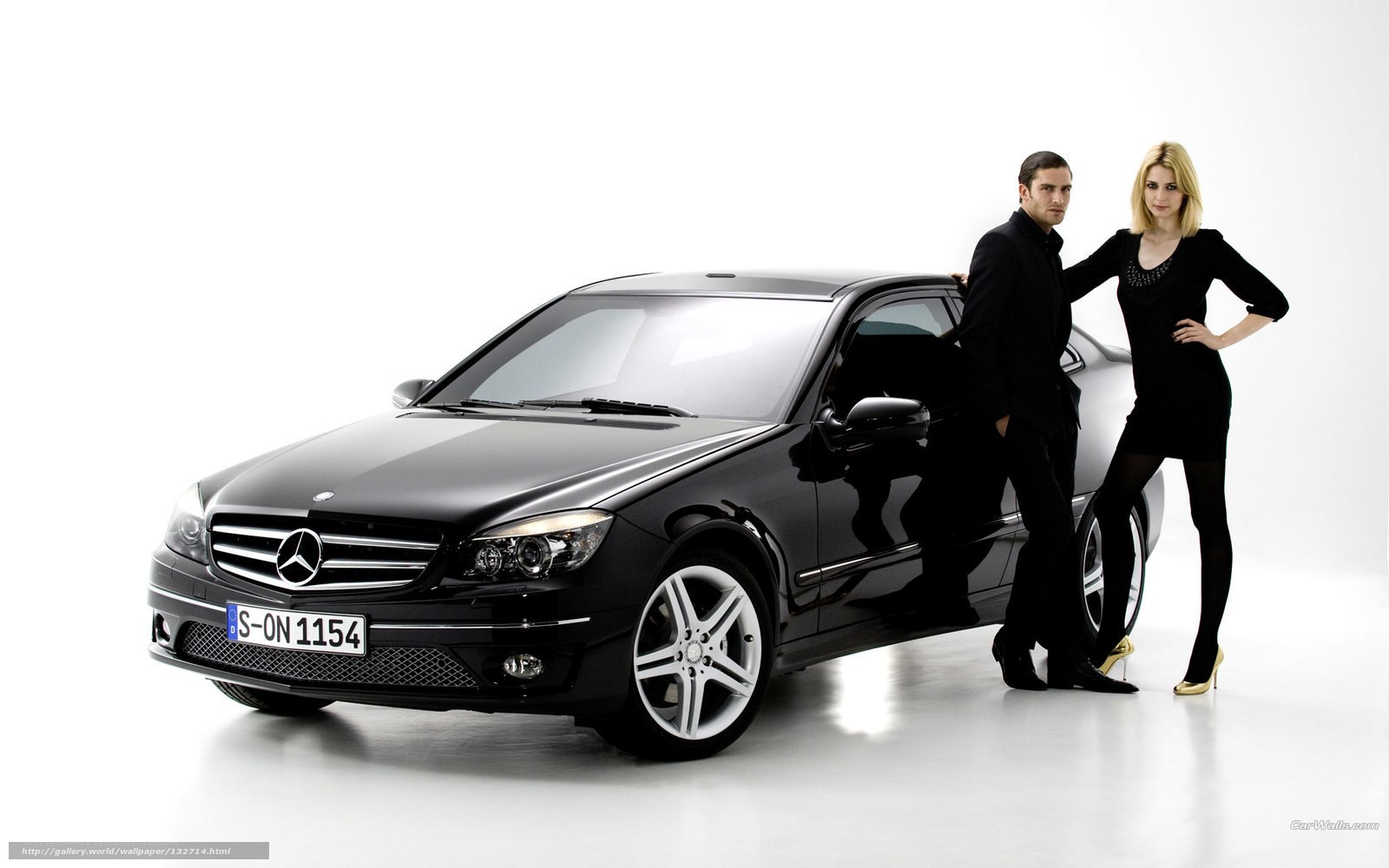 Couple with black Mercedes-Benz