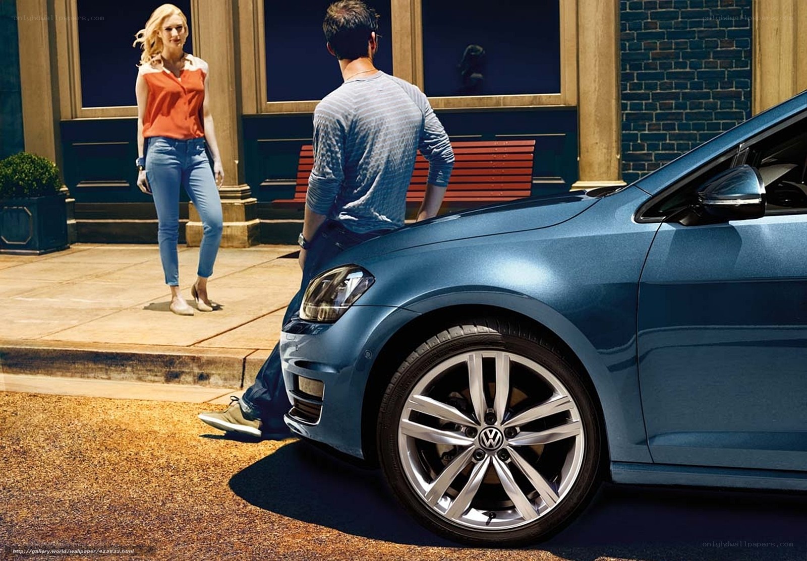 Couple with blue car on street