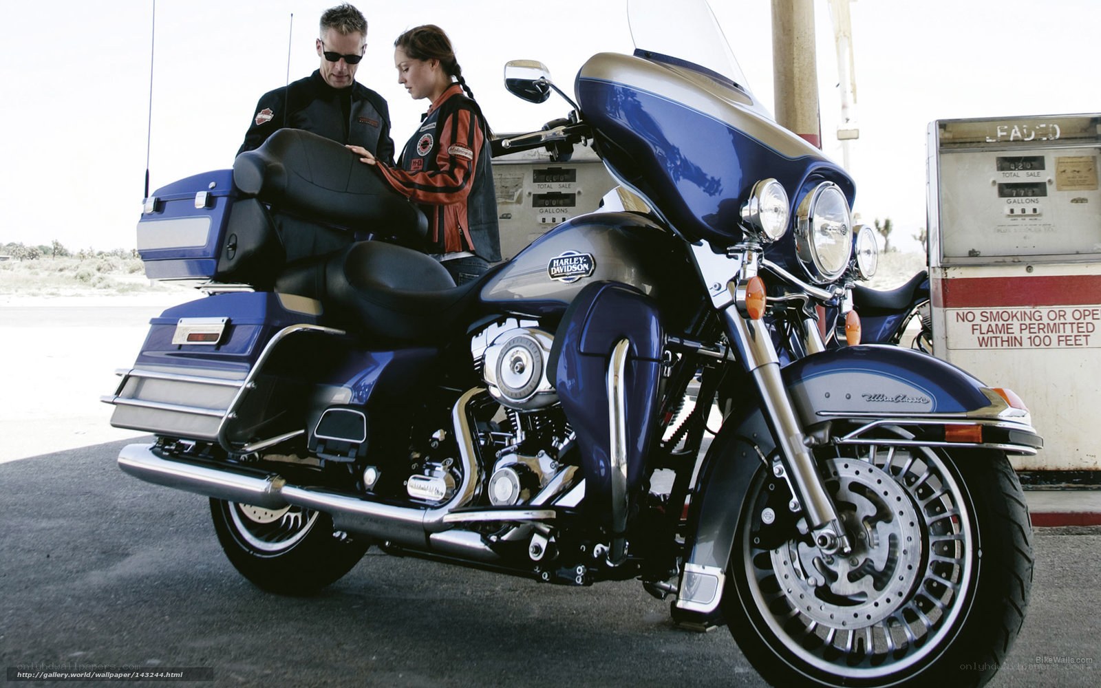 Couple with blue motorcycle