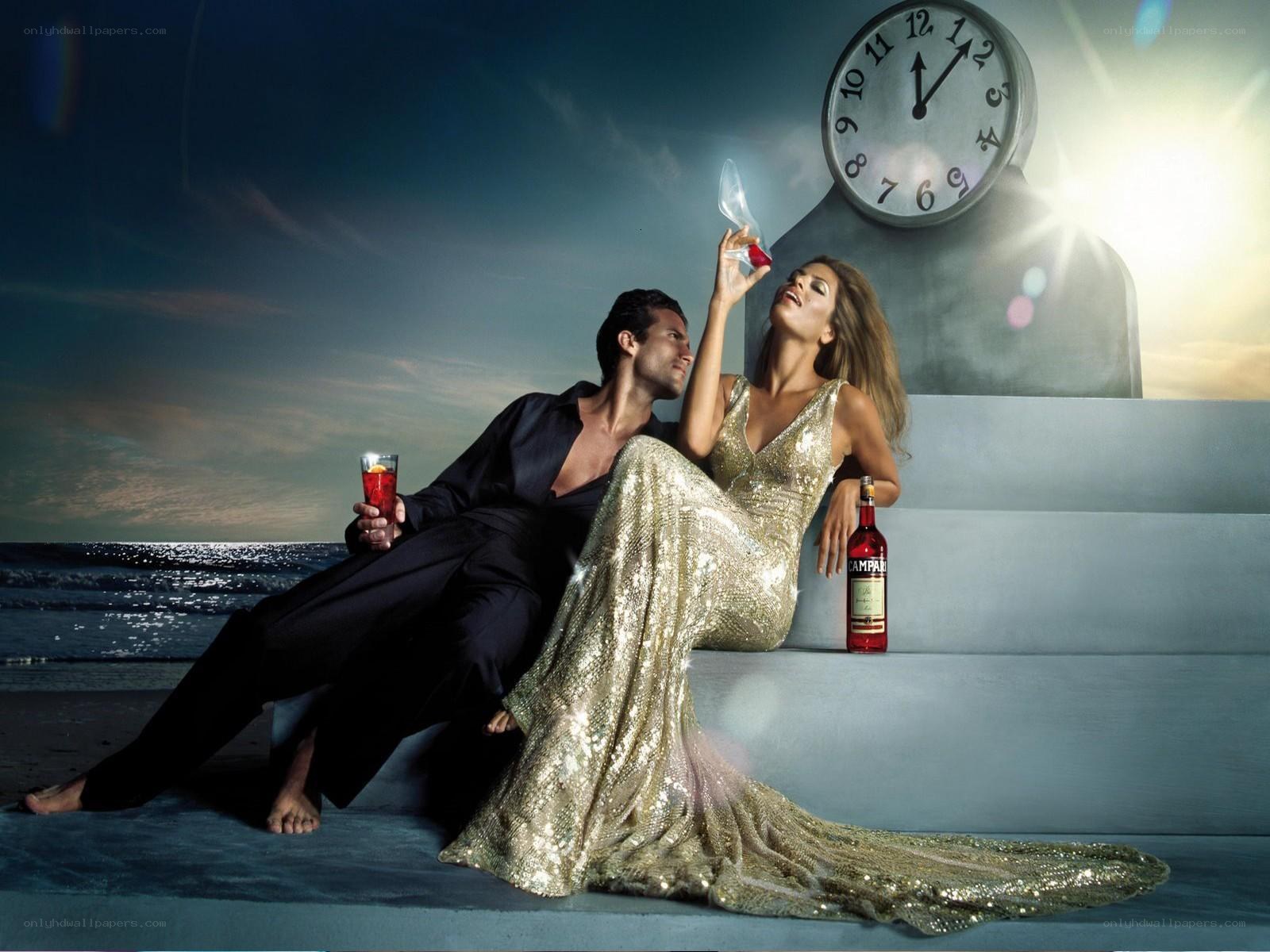 Couple with Campari on beach