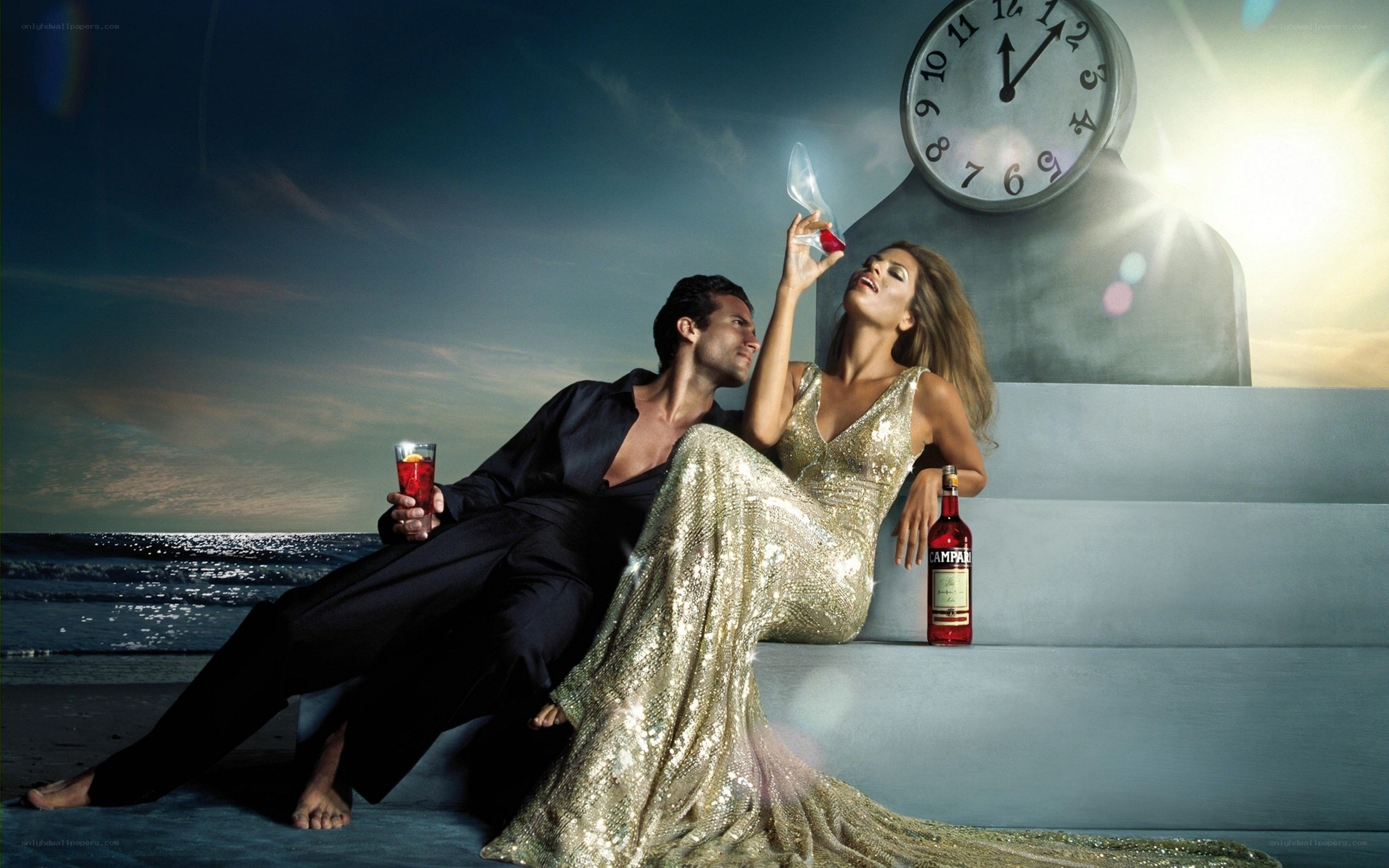 Couple with Campari on beach