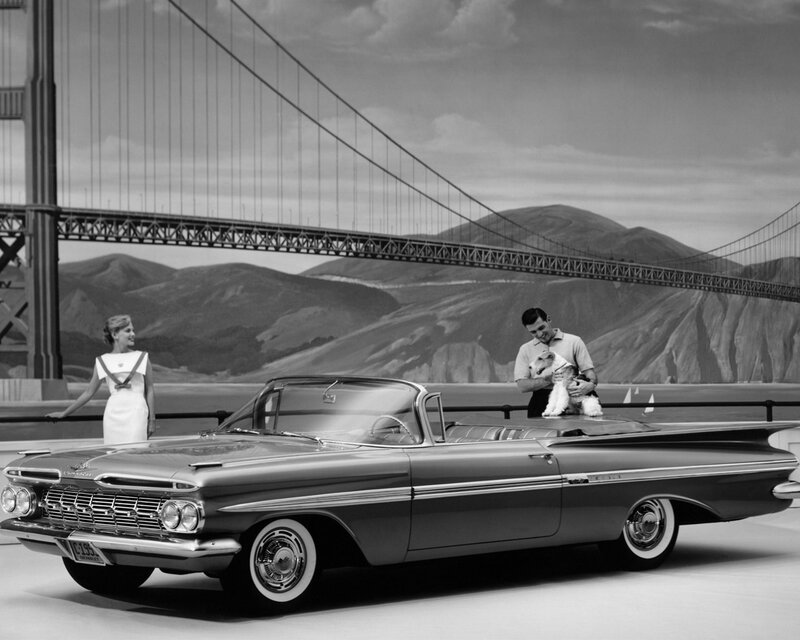 Couple with car and dog