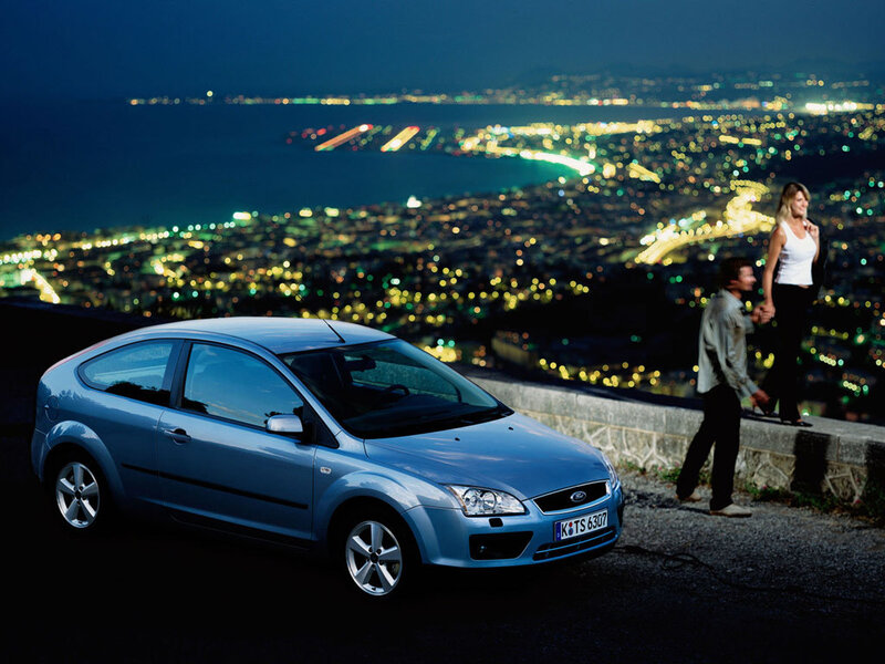 Couple with car at night overlook