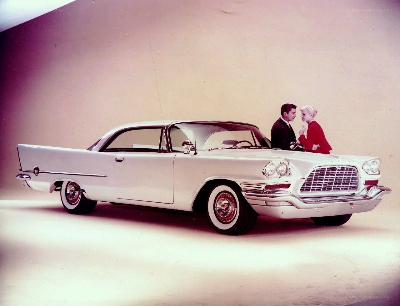Couple with classic car