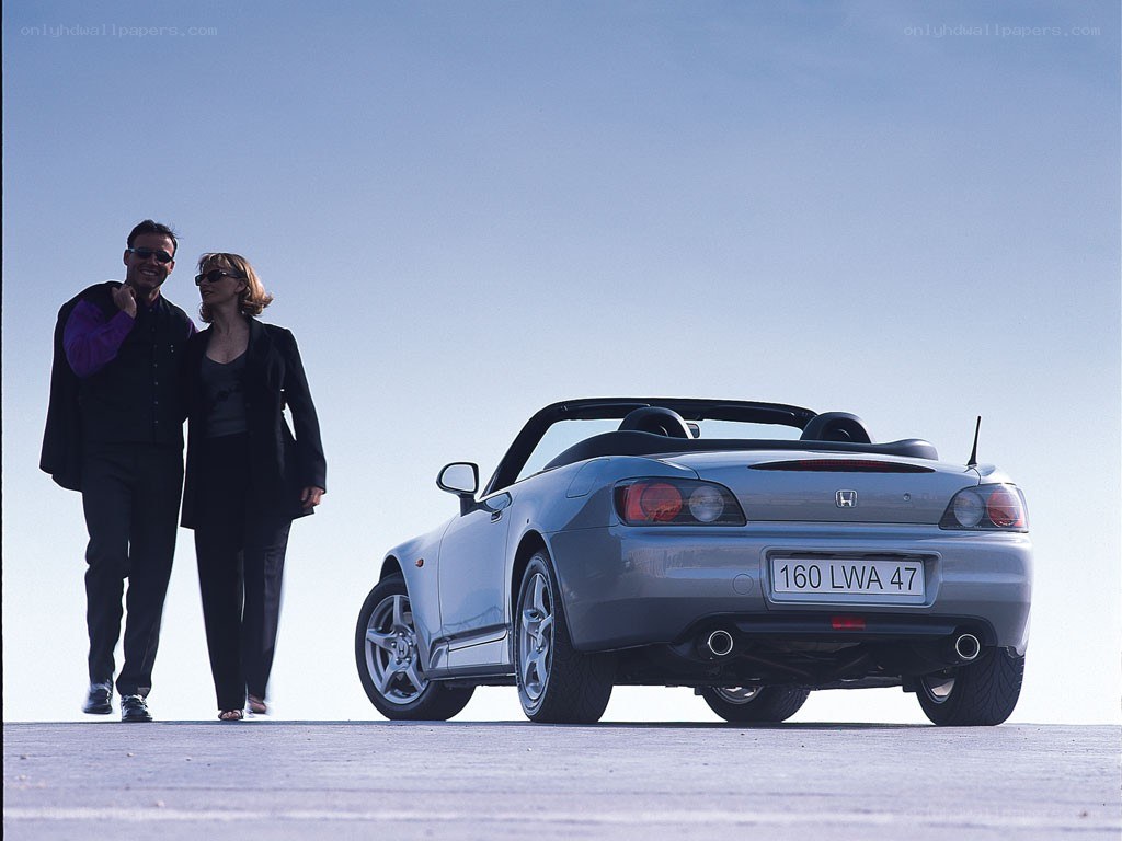 Couple with convertible car