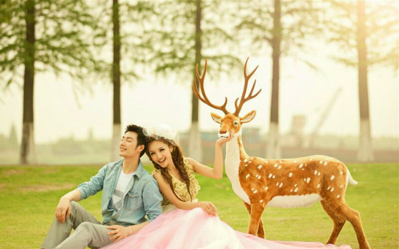 Couple with Deer Statue