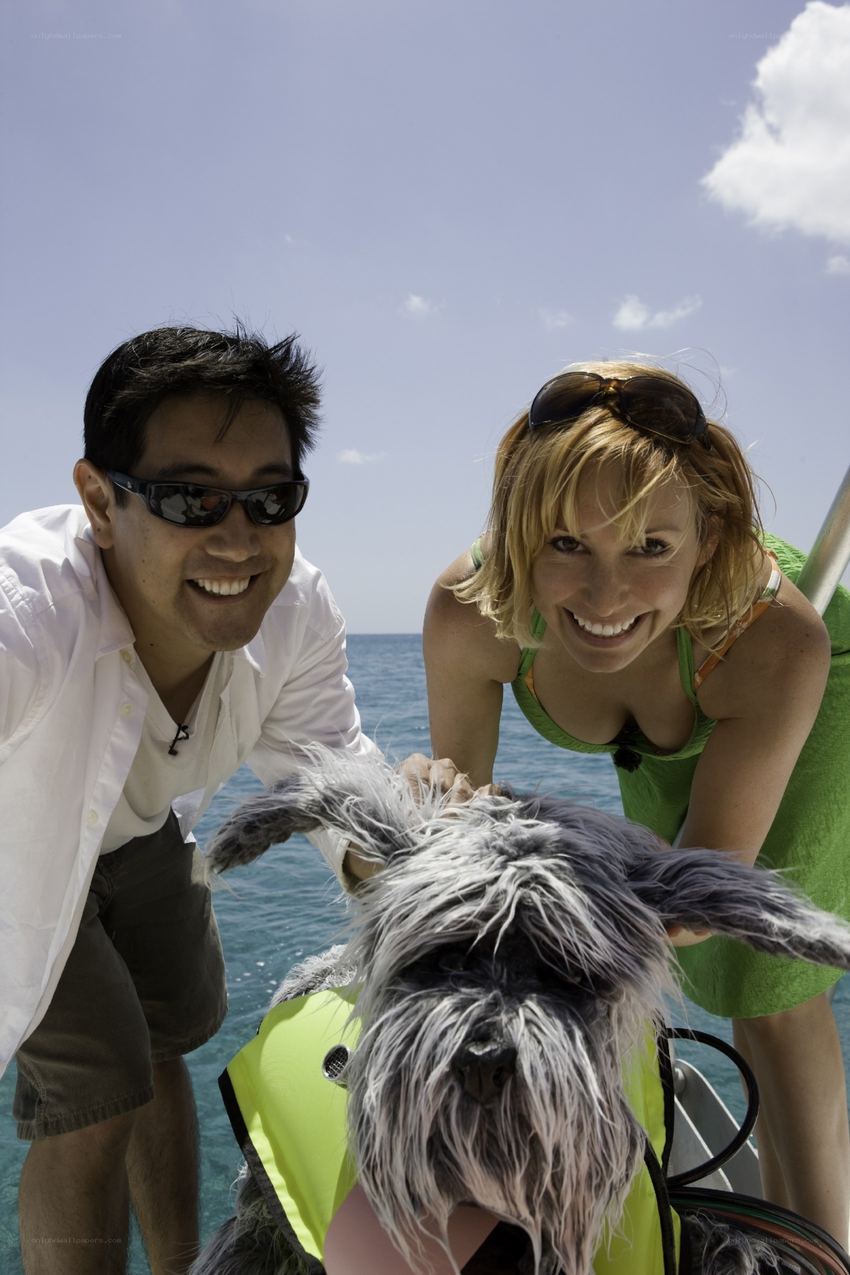 Couple with dog on boat