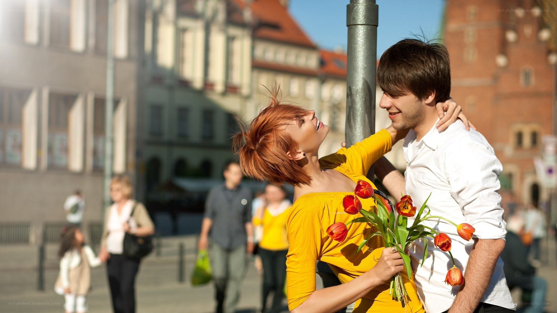 Couple with flowers in city