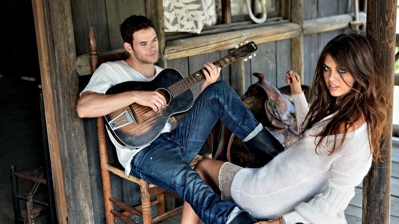 Couple with guitar on porch