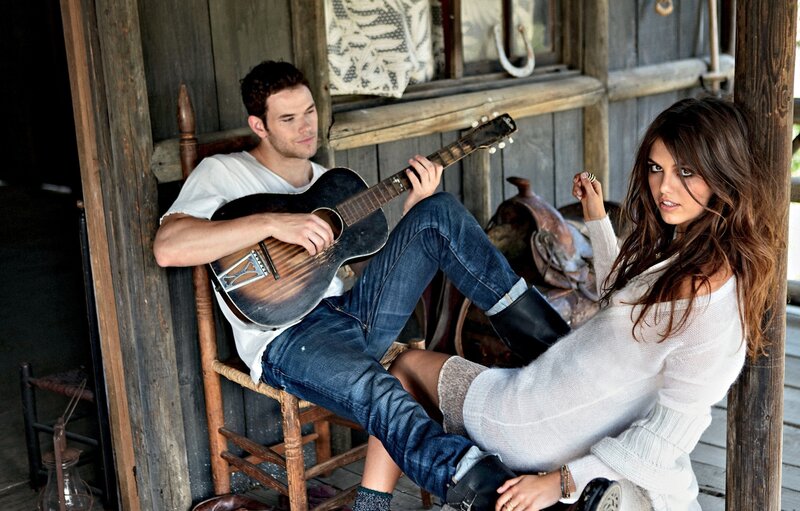 Couple with guitar on porch
