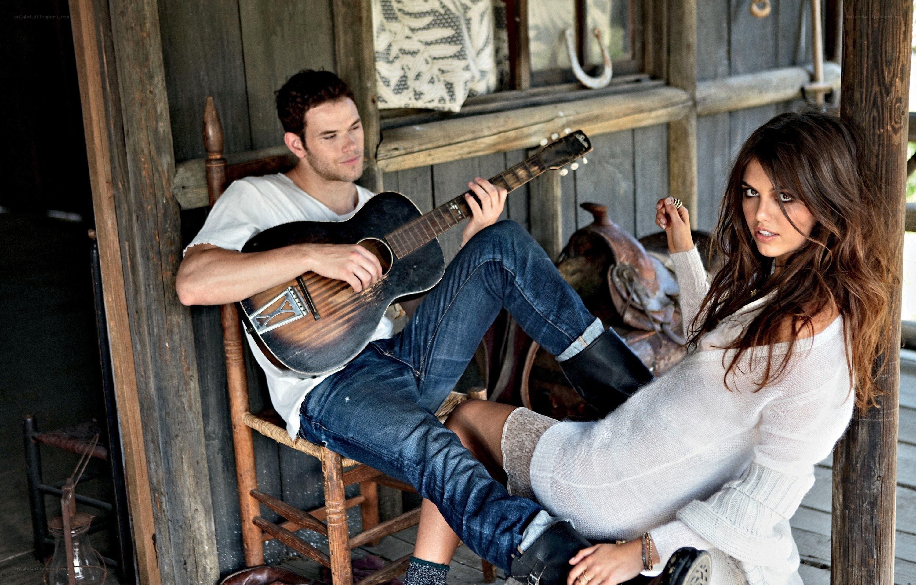 Couple with guitar on porch