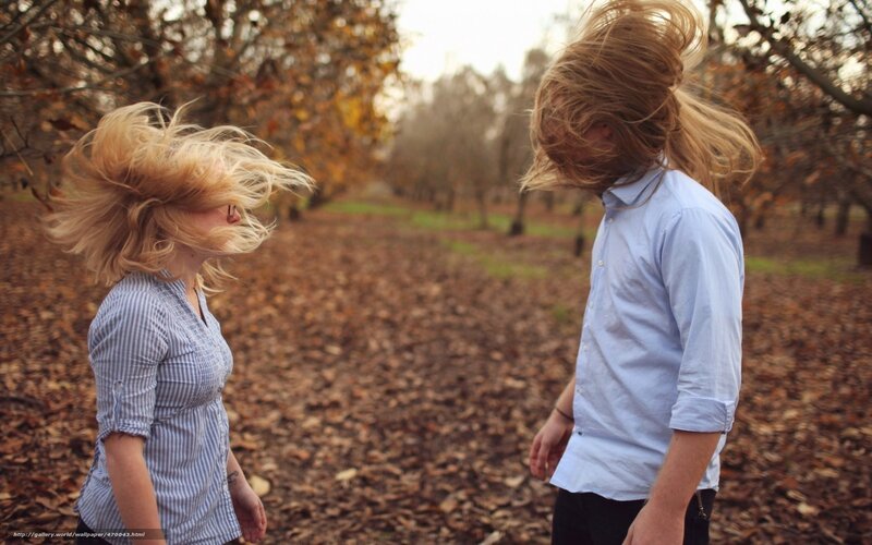 Couple with hair blowing in wind