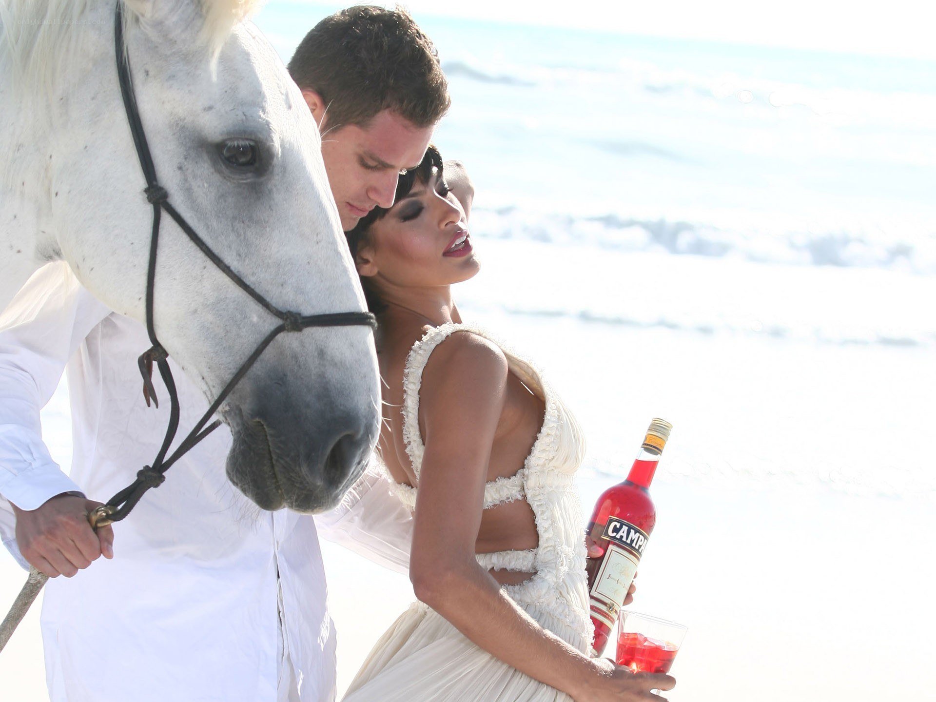 Couple with horse on beach