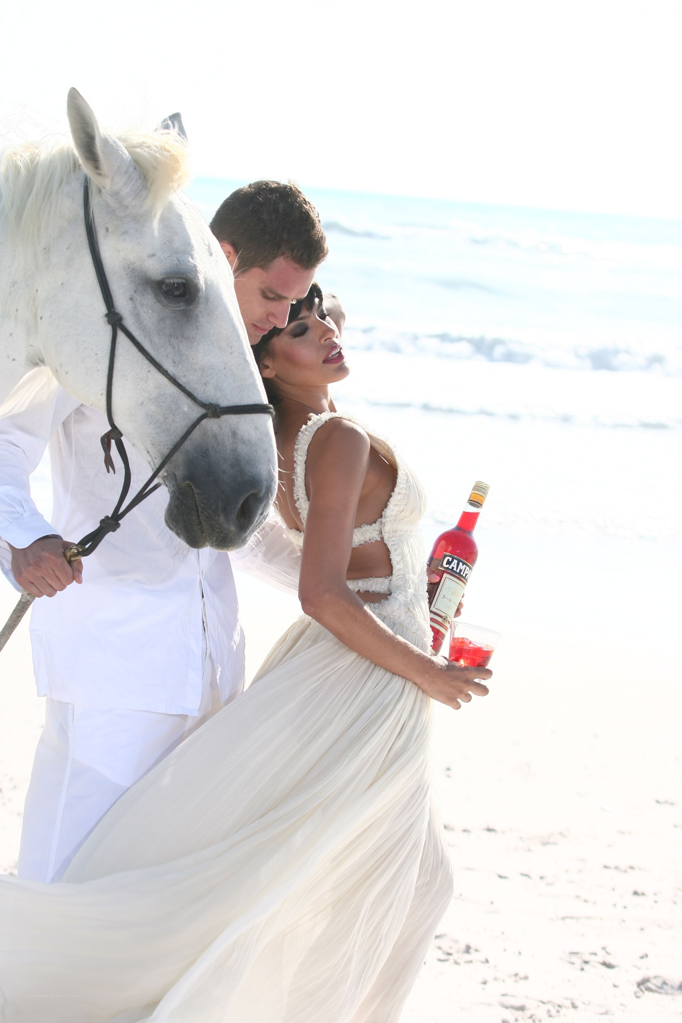 Couple with horse on beach