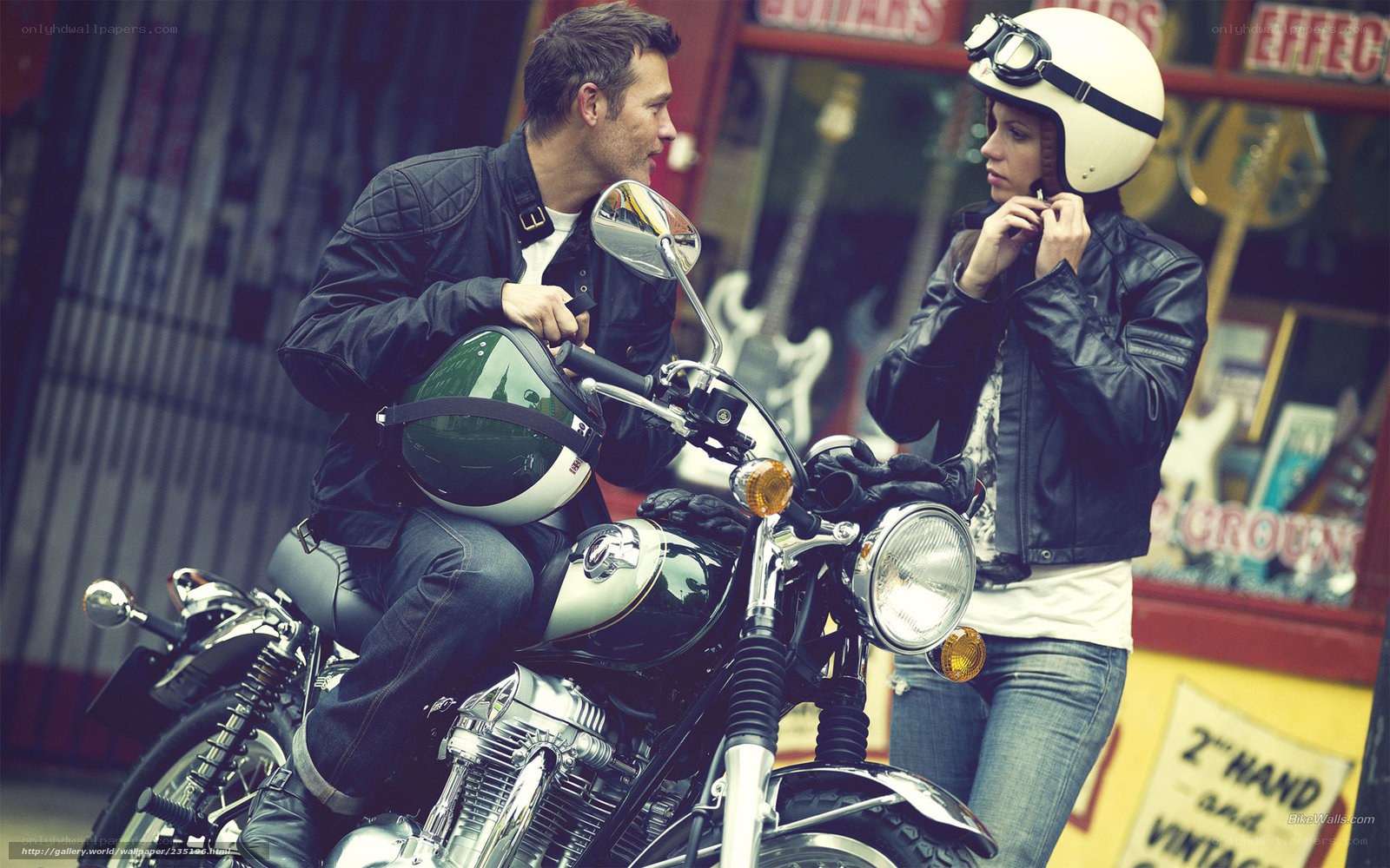 Couple with motorcycle in city
