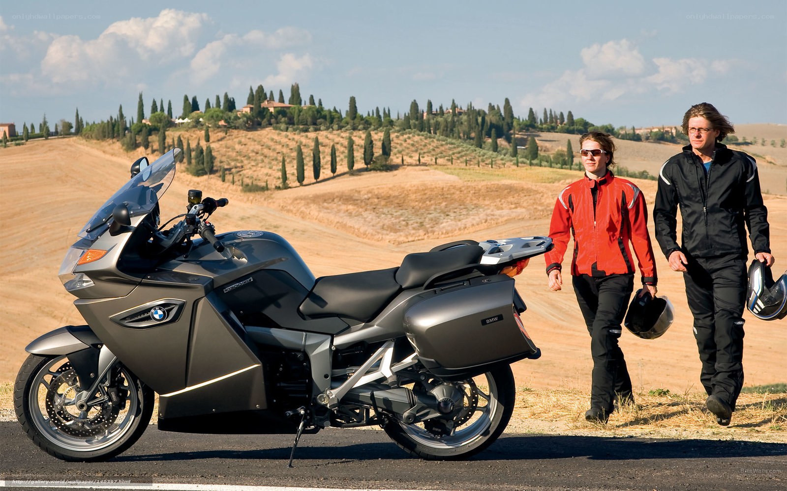 Couple with motorcycle in countryside