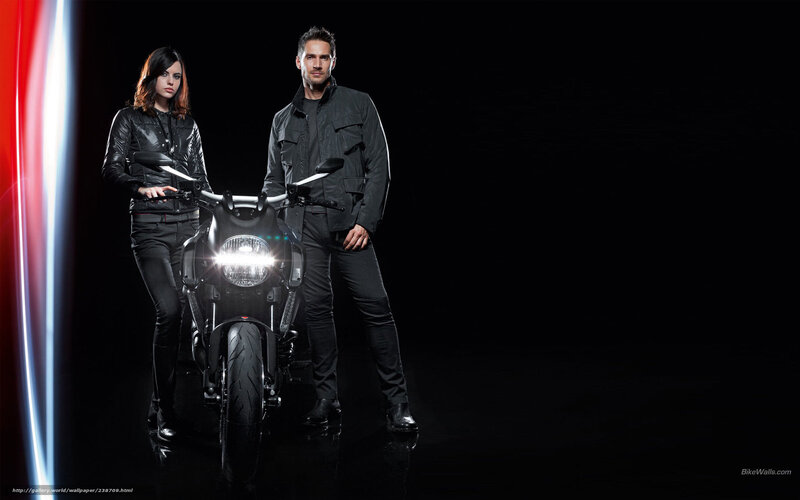 couple with motorcycle in studio