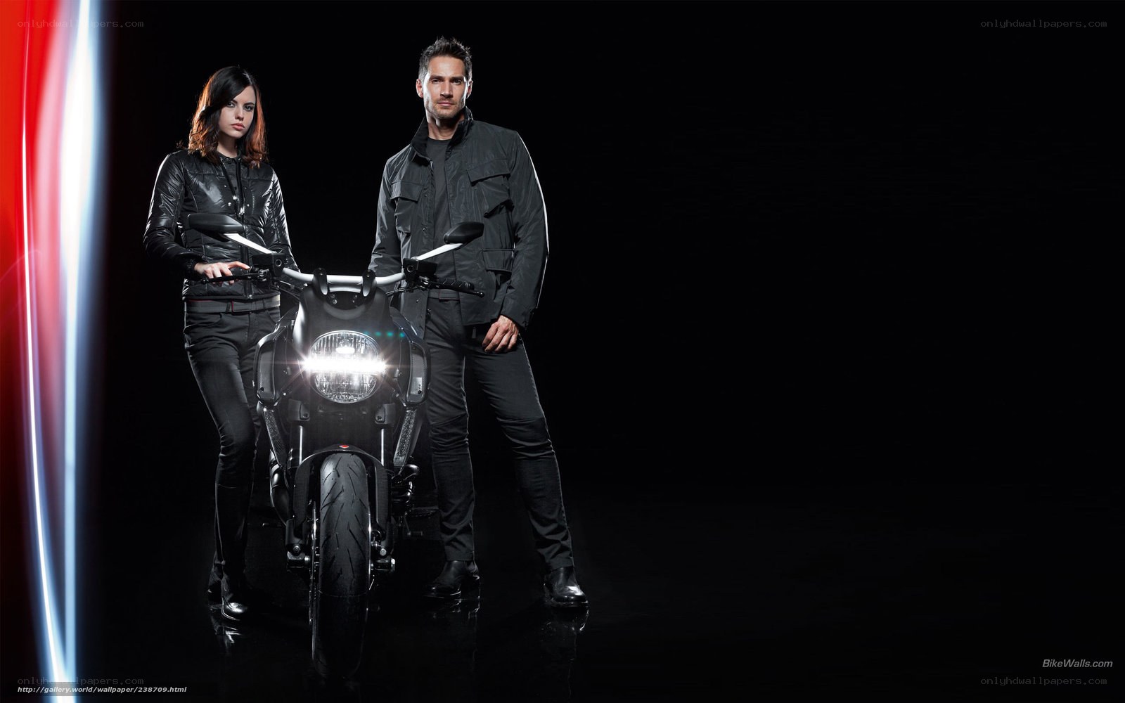 couple with motorcycle in studio