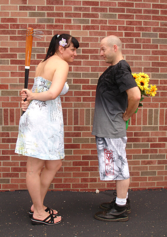 Couple with props facing each other