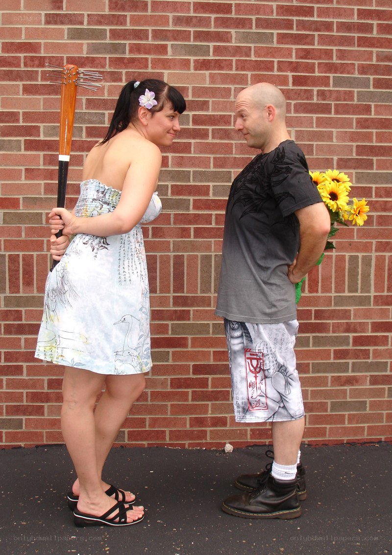 Couple with props facing each other
