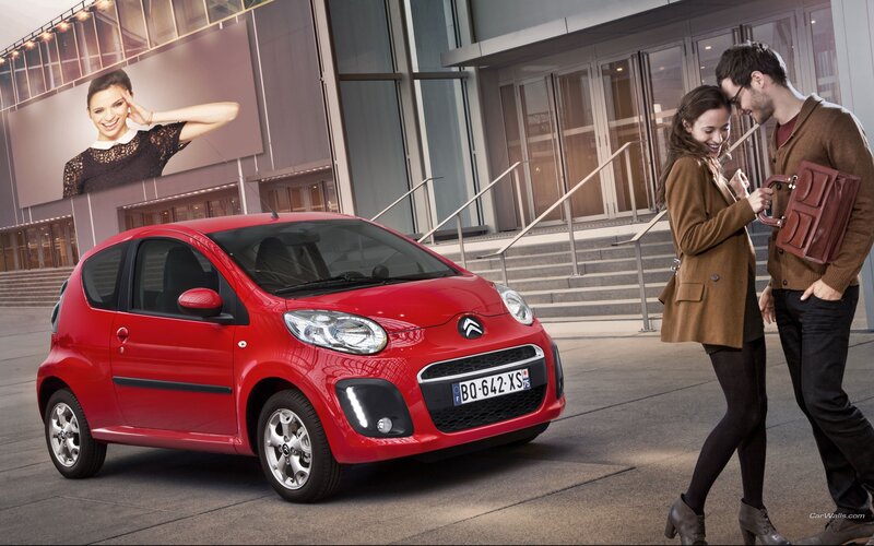 Couple with red car