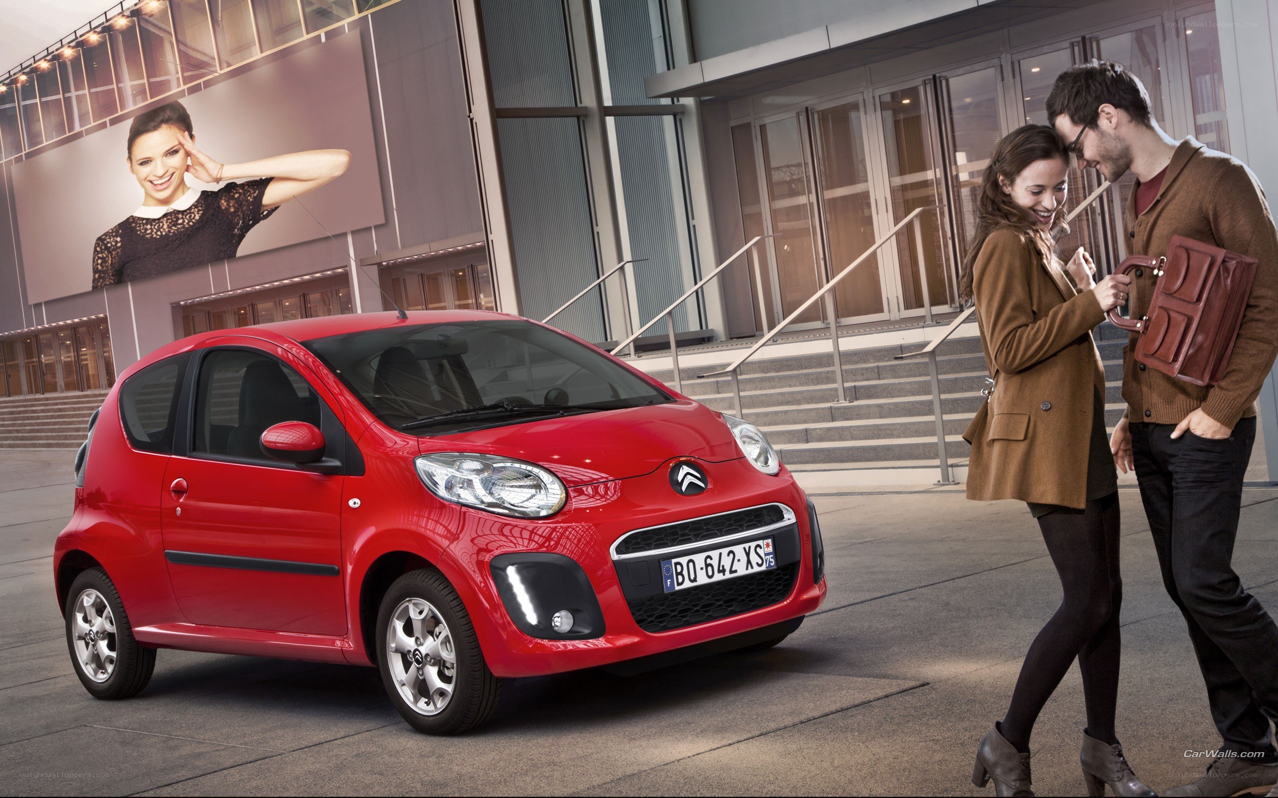 Couple with red car