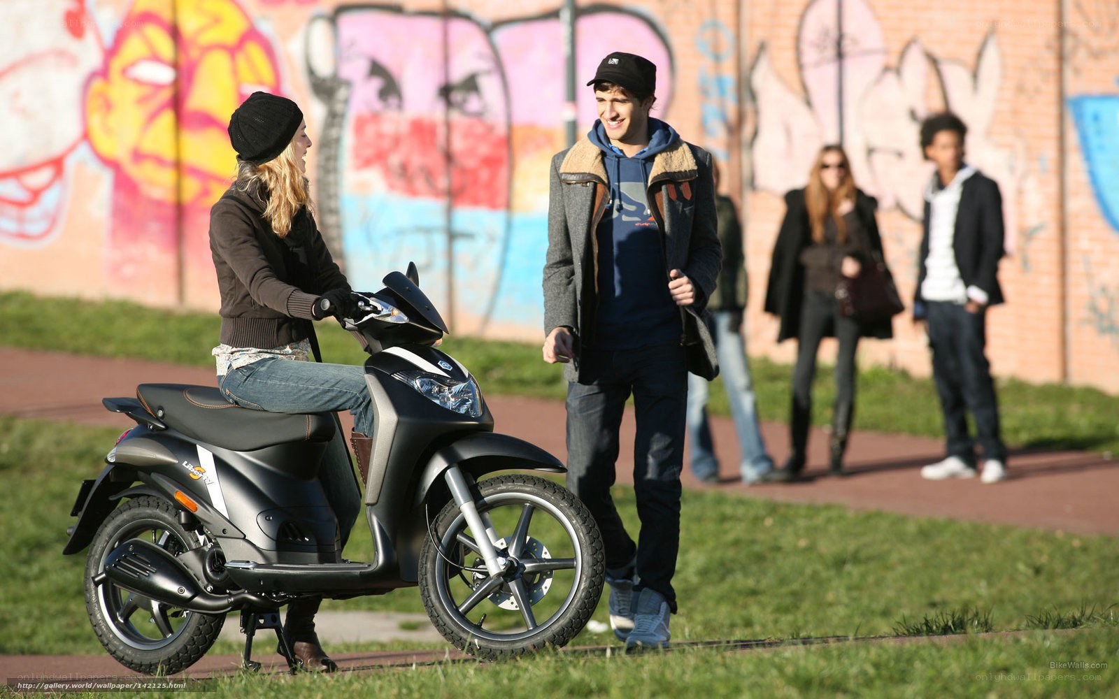 Couple with scooter in park