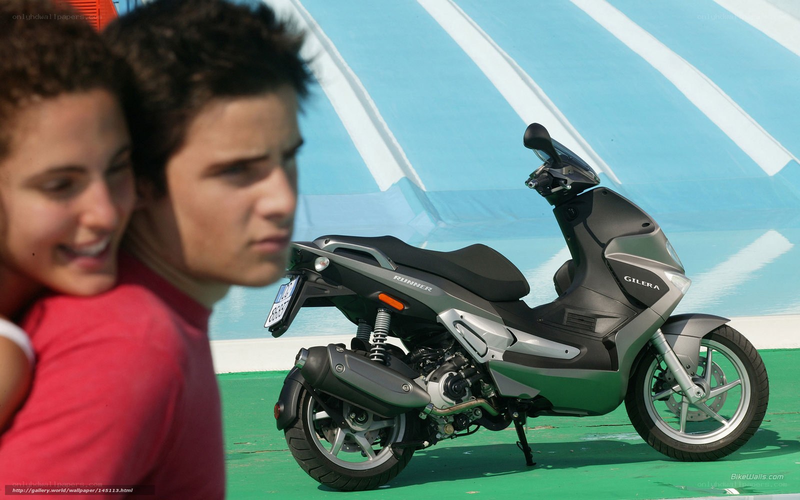Couple with scooter on display