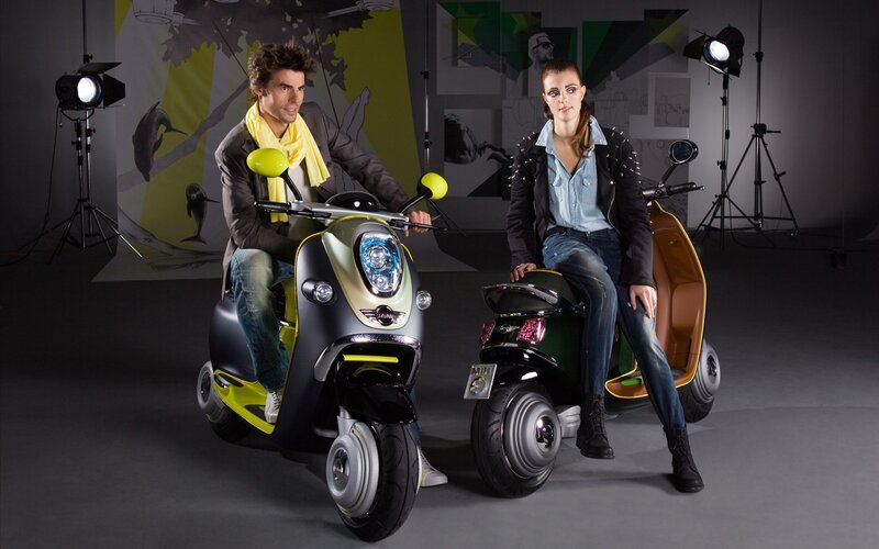 Couple with scooters in studio