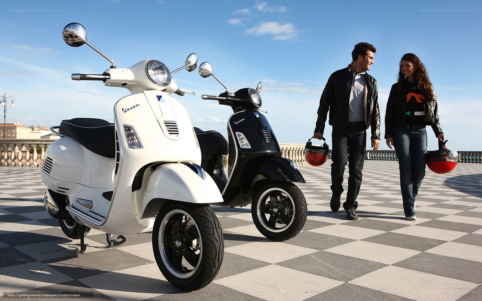 Couple with scooters on terrace