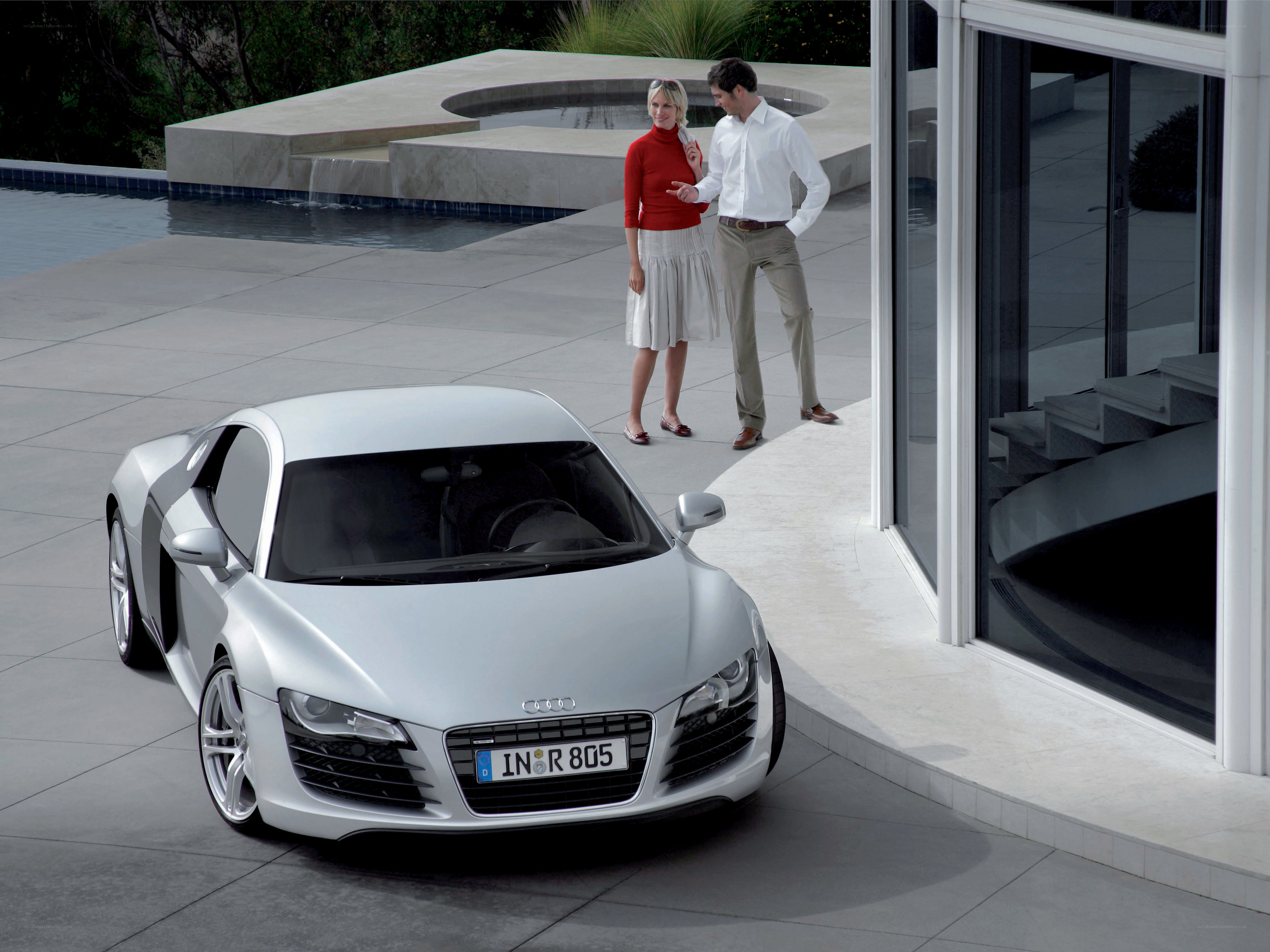 Couple with silver Audi R8