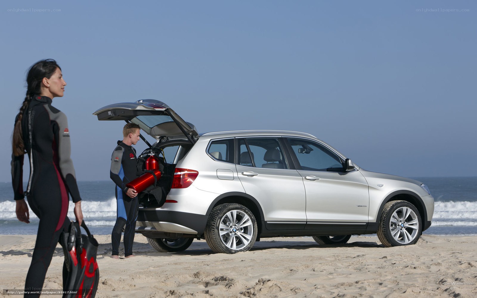 Couple with SUV on beach