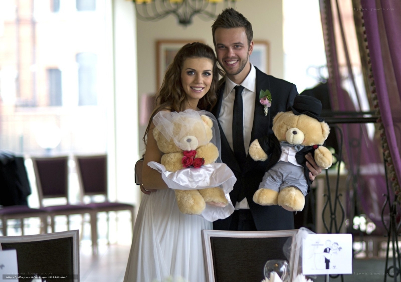 Couple with teddy bears at wedding