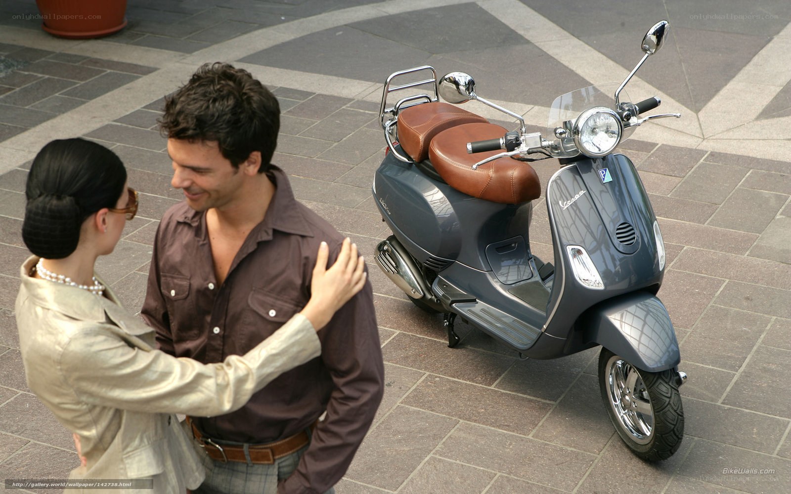 Couple with Vespa scooter
