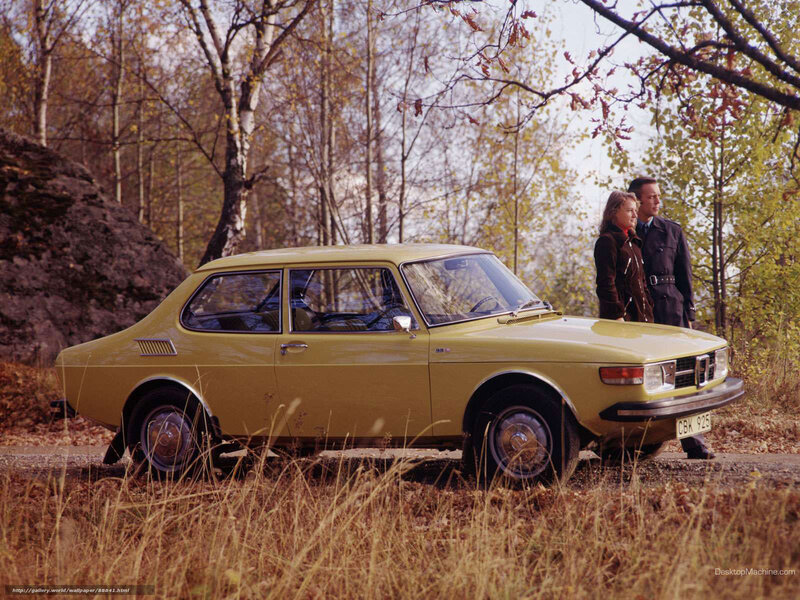 Couple with vintage car in autumn
