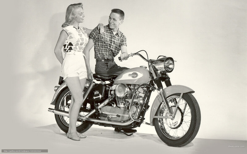 Couple with vintage motorcycle