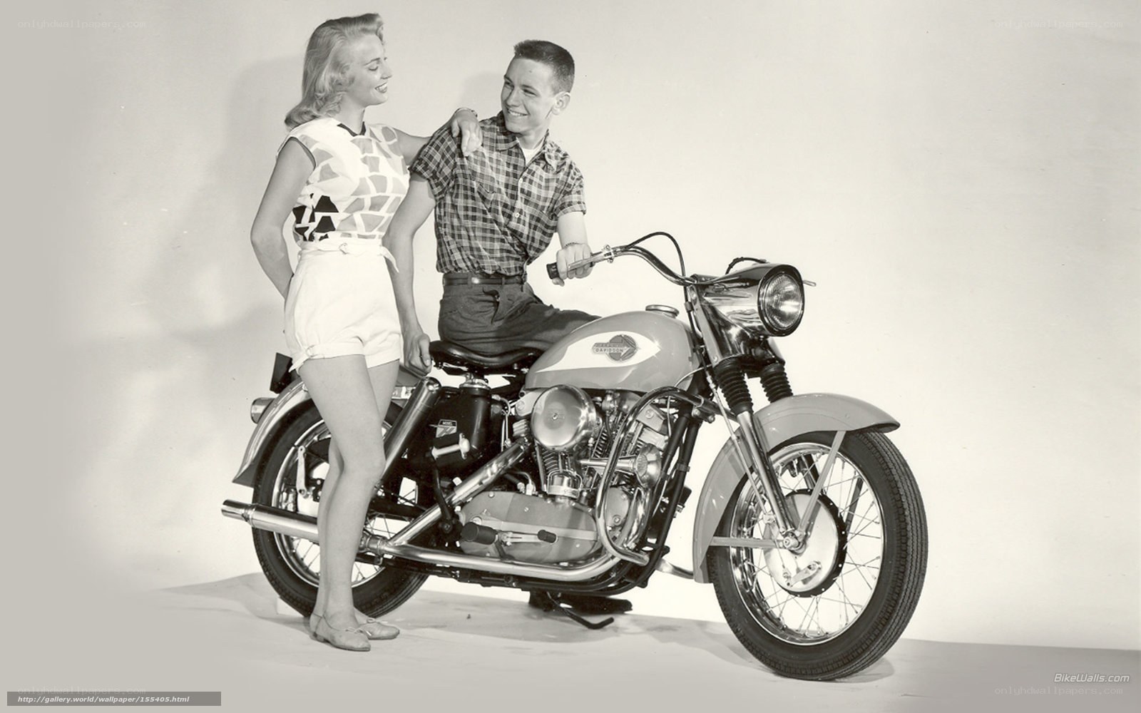 Couple with vintage motorcycle