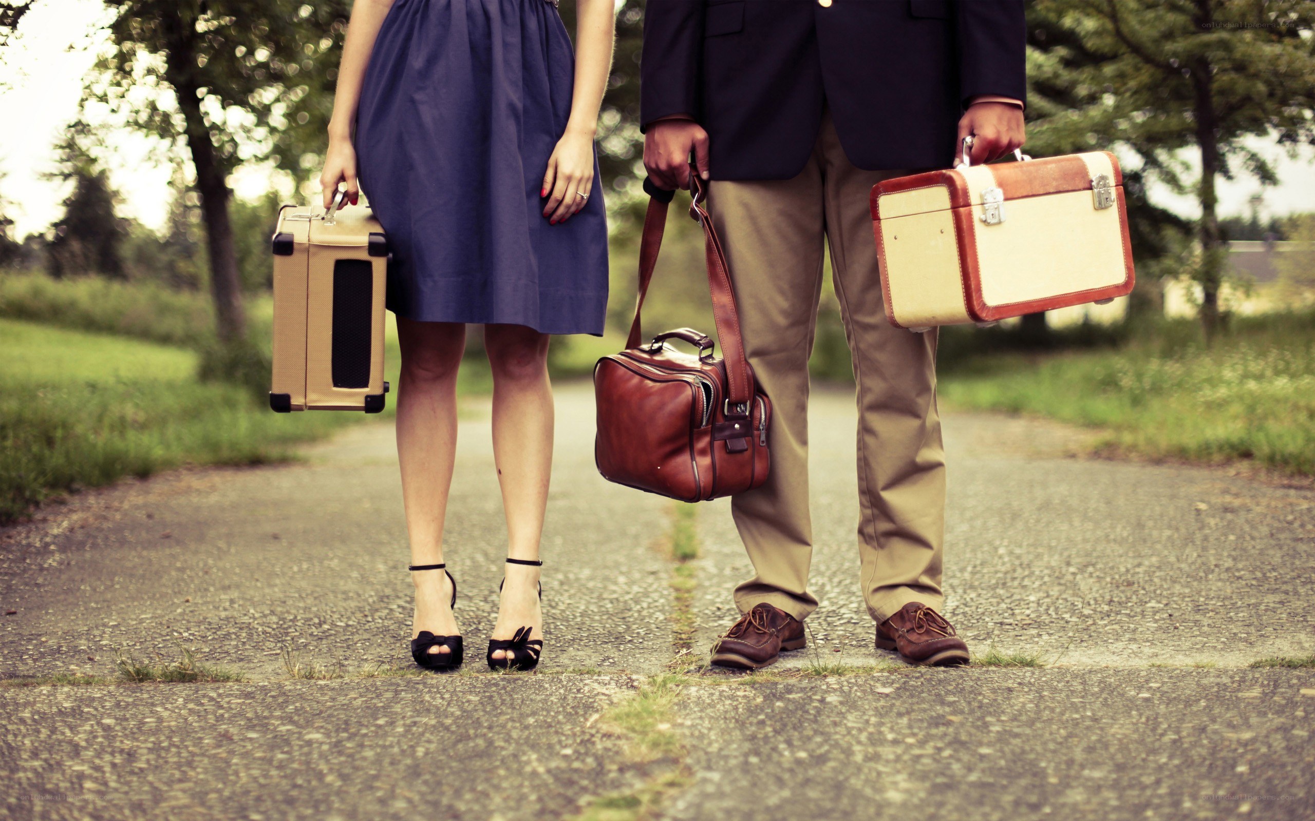 couple with vintage suitcases