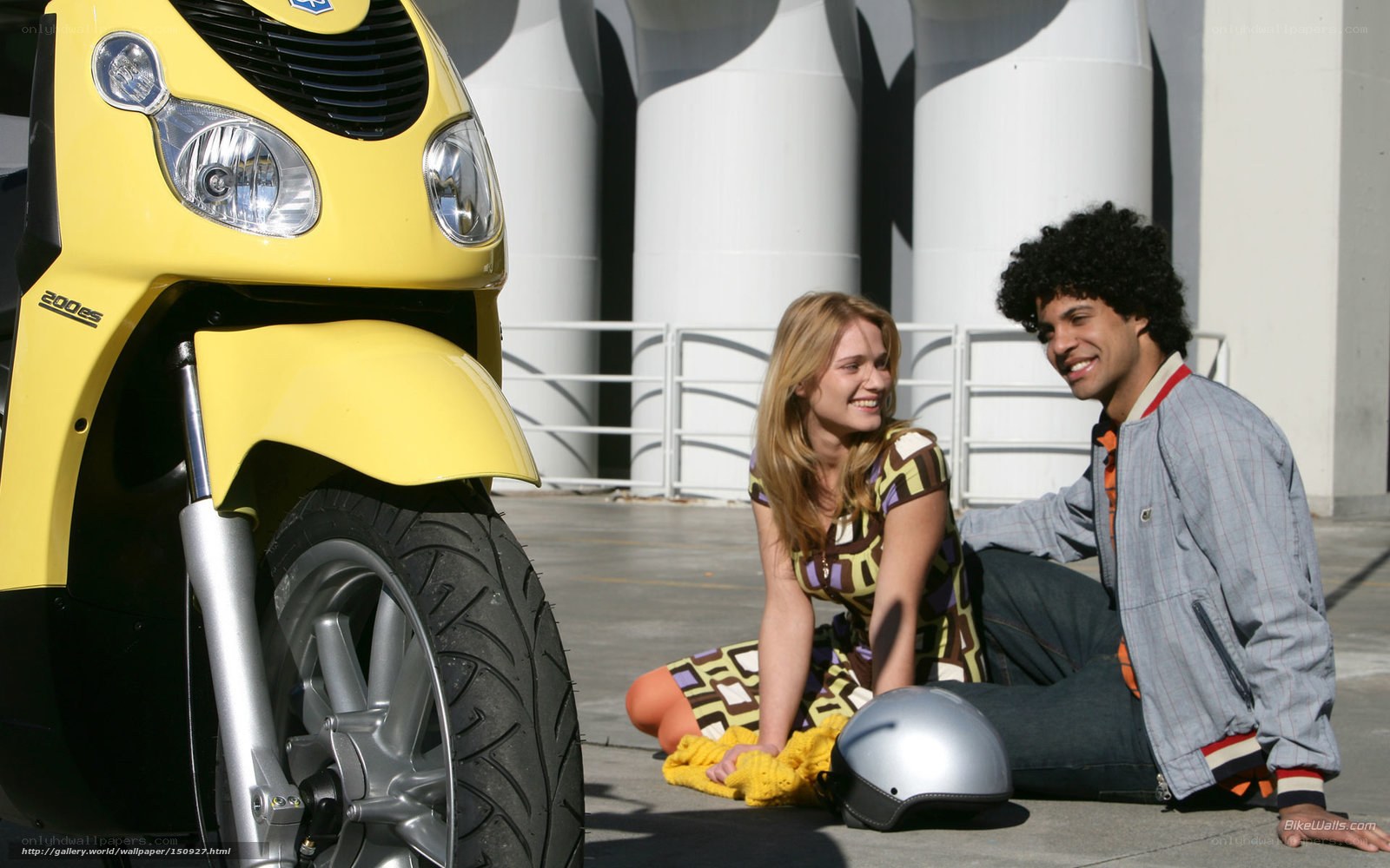 Couple with yellow scooter