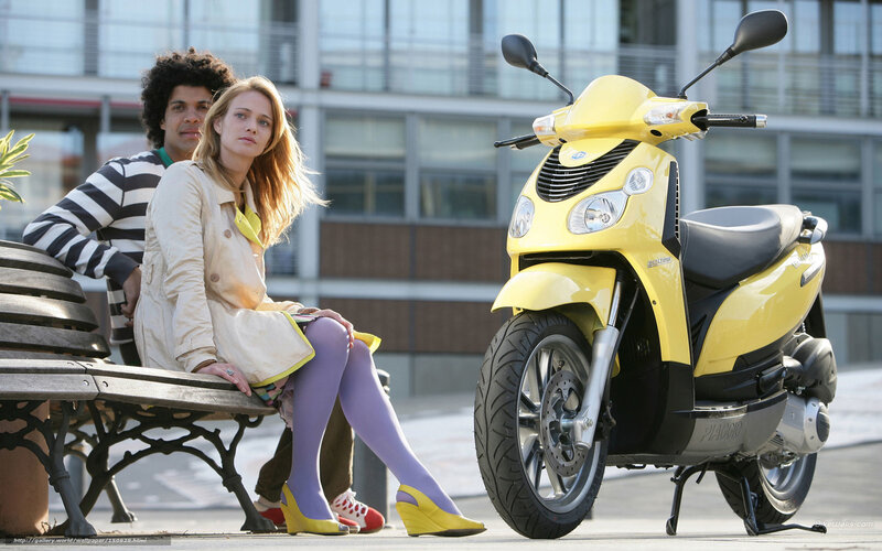 Couple with yellow scooter