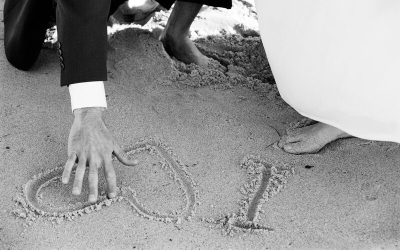 Couple Writing on Sand