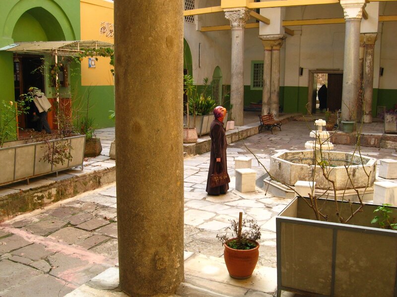 Courtyard with fountain and people