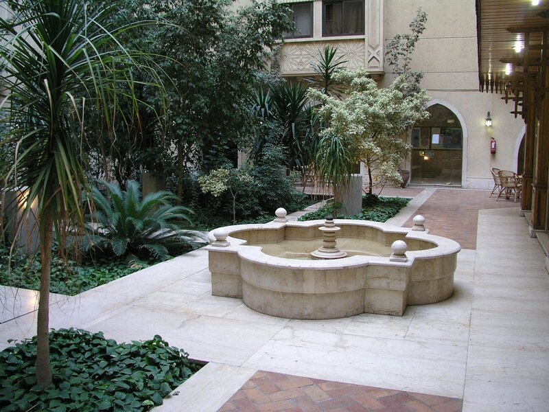 Courtyard with fountain and plants