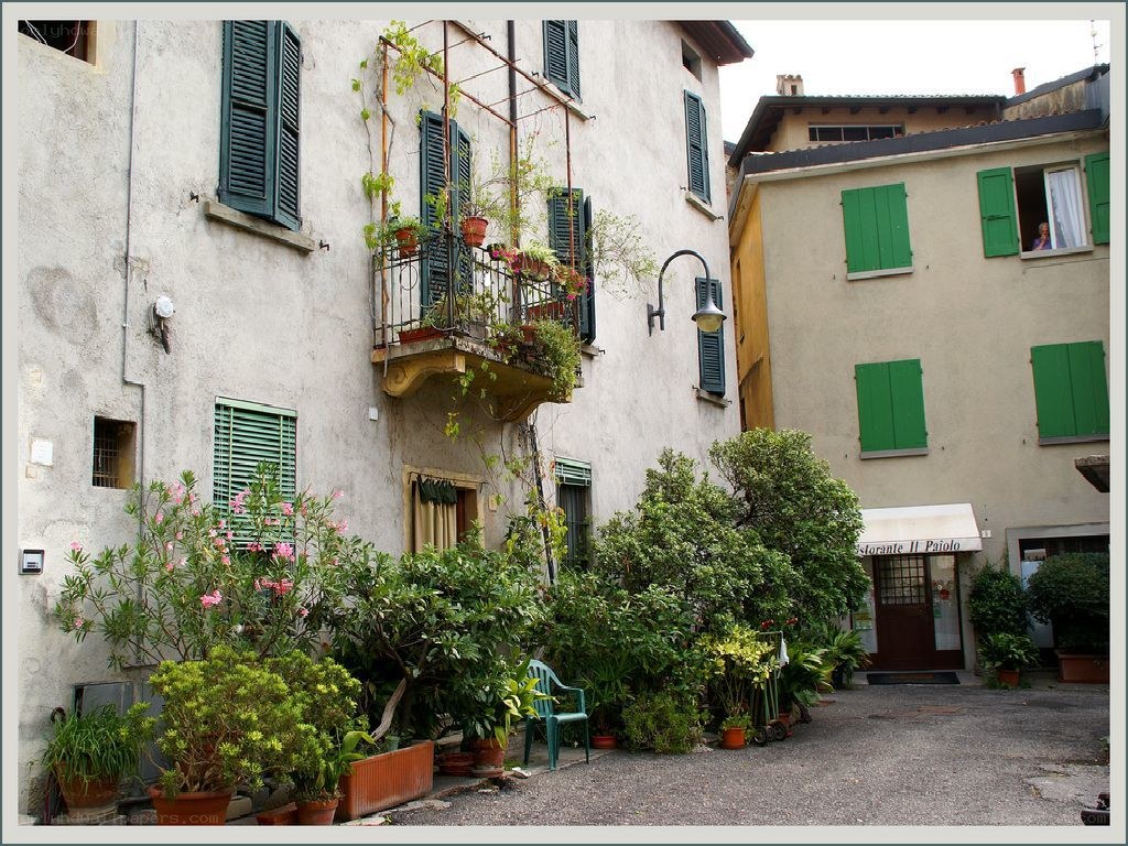 Courtyard with green shutters